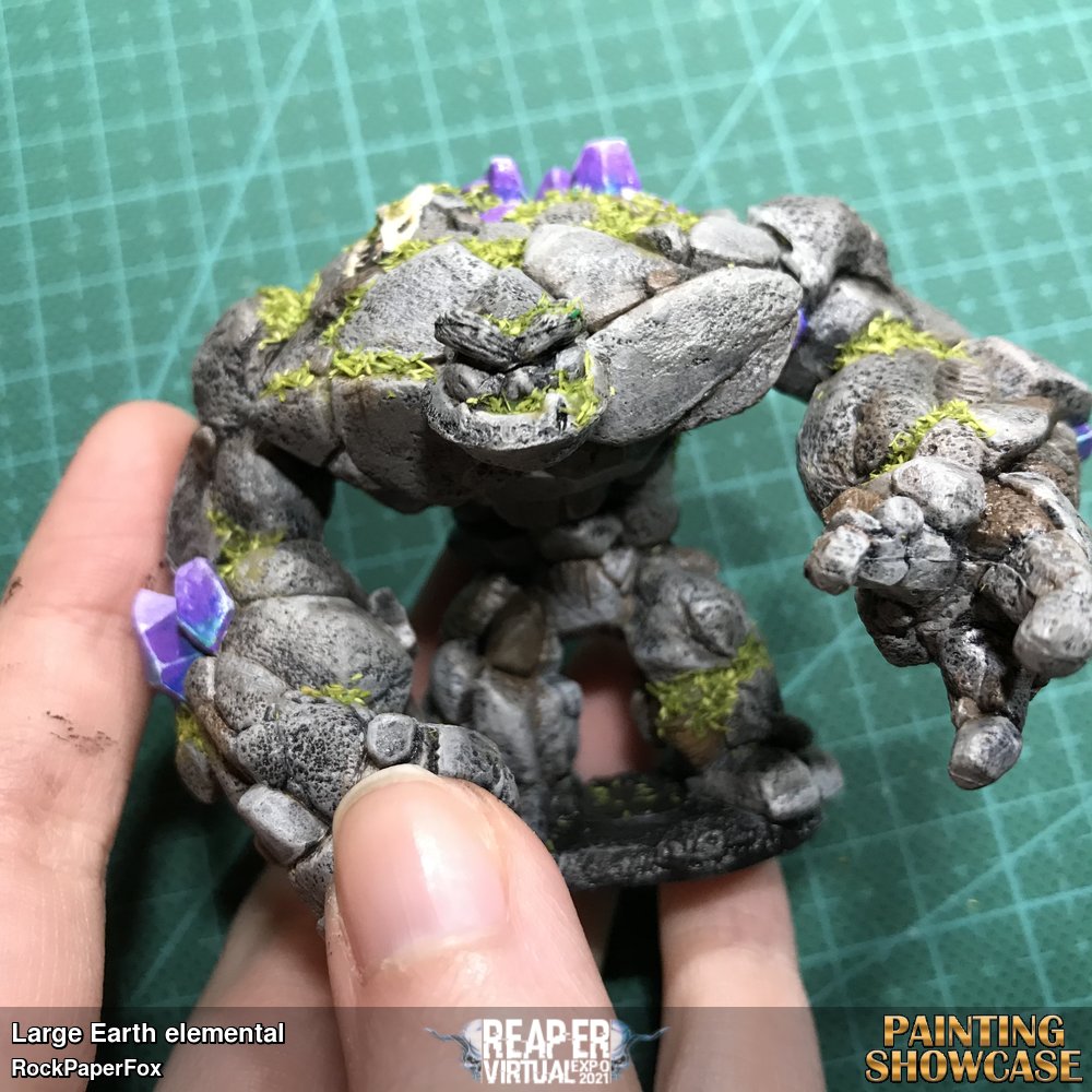 A fierce or friendly fellow of moss and stone.
Painted with craftsmart multi surface acrylics, he is a black base coat, with various color layering, drybrush and weathering techniques, with crystal painting and highlights, and is turfed with moss.